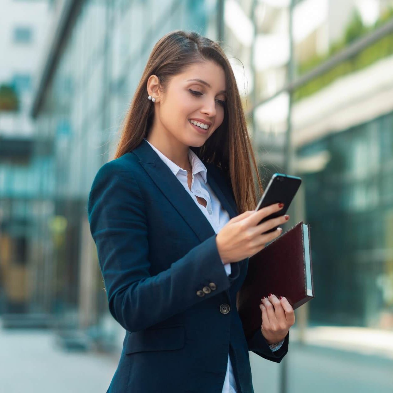 A young professional looking at her phone